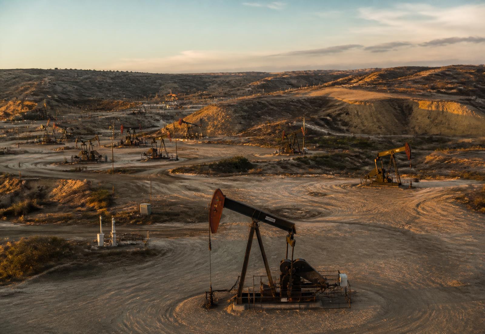 Oil pumpjack at sunset